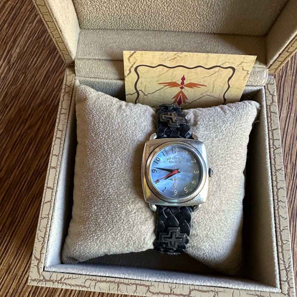 Peyote Bird Santa Fe with crosses on black braided leather.